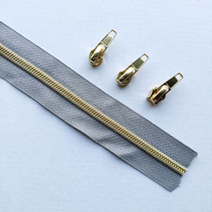 1 m Reiverschluss metallisiert GOLD 6,5mm Spirale + 3 Schieber, mittelgrau