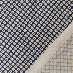 Baumwollstoff Kringel-Muster dunkelblau-beige