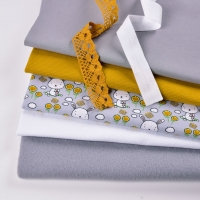 Jerseystoff Hasen Blumen Schmetterlinge, hellgrau