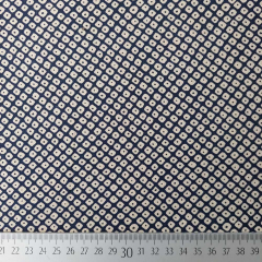 Baumwollstoff Kringel-Muster dunkelblau-beige