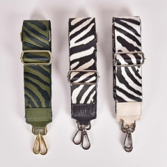 Taschengurt Taschenriemen Zebra Muster,schwarz cremewei mit cremeweien Lederenden, silberfarbige Schnalle