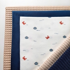 Jerseystoff Krebse Wellen, jeansblau rotbraun cremewei