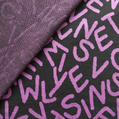 Jacquard Strickstoff Buchstaben, lila schwarz