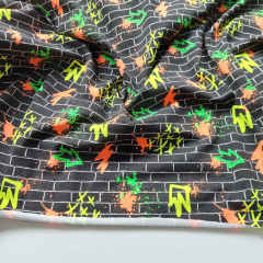 Jerseystoff Mauer Graffiti Neonfarben, schwarz