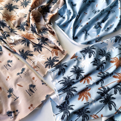 Jerseystoff Palmen, dunkelblau braun hellblau
