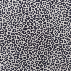 Cordstoff schmale Rippen kleine Leopardenmuster, schwarz ecrue